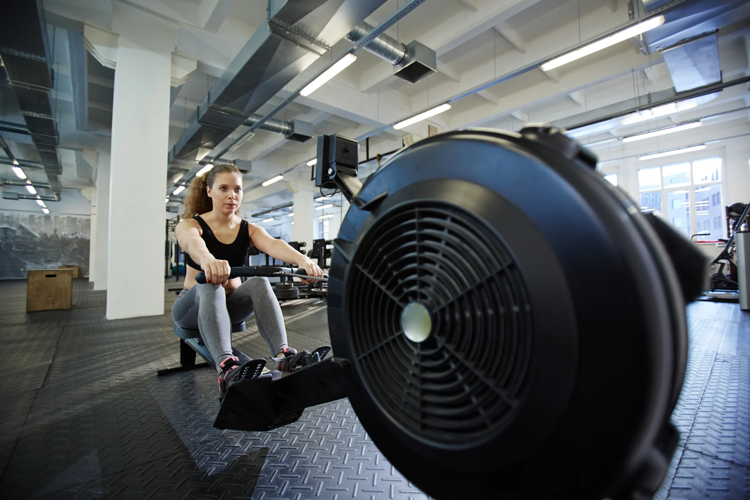Exercise_For_Strength_original_372083 Woman Using Row Machine During an Adult Conditioning Workout